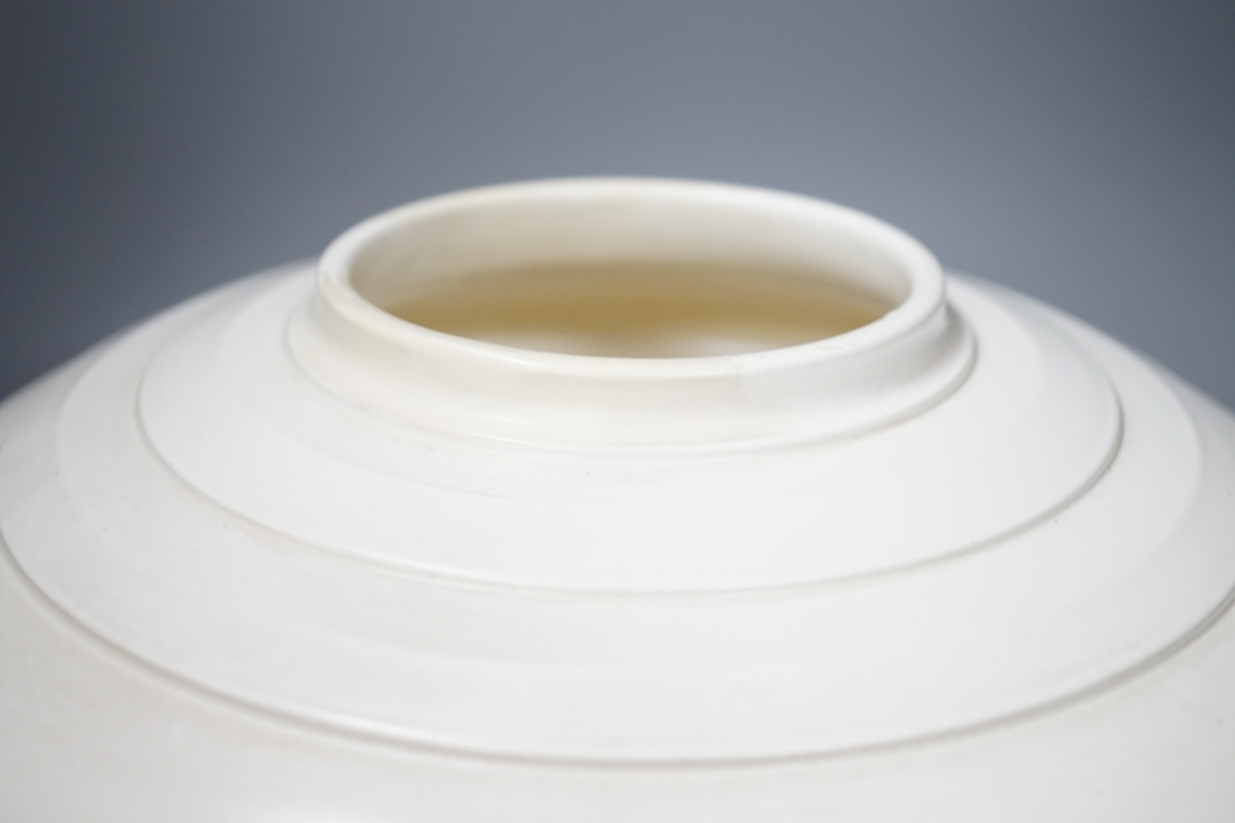 A large Keith Murray moonstone vase, restored, 26cm diameter